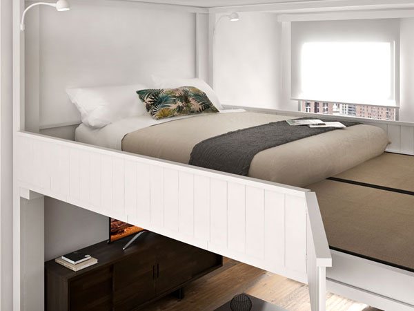 Close-up of a white Rising platform: solid railing, walkable tatami floor around the mattress, reading lights